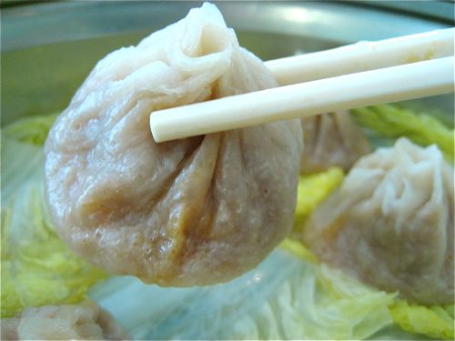 picking up a soup dumpling